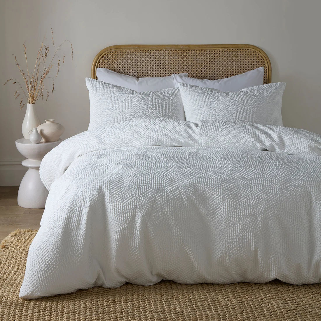 Serene Embossed Geo textured duvet cover set in white with an embossed geometric pattern.
