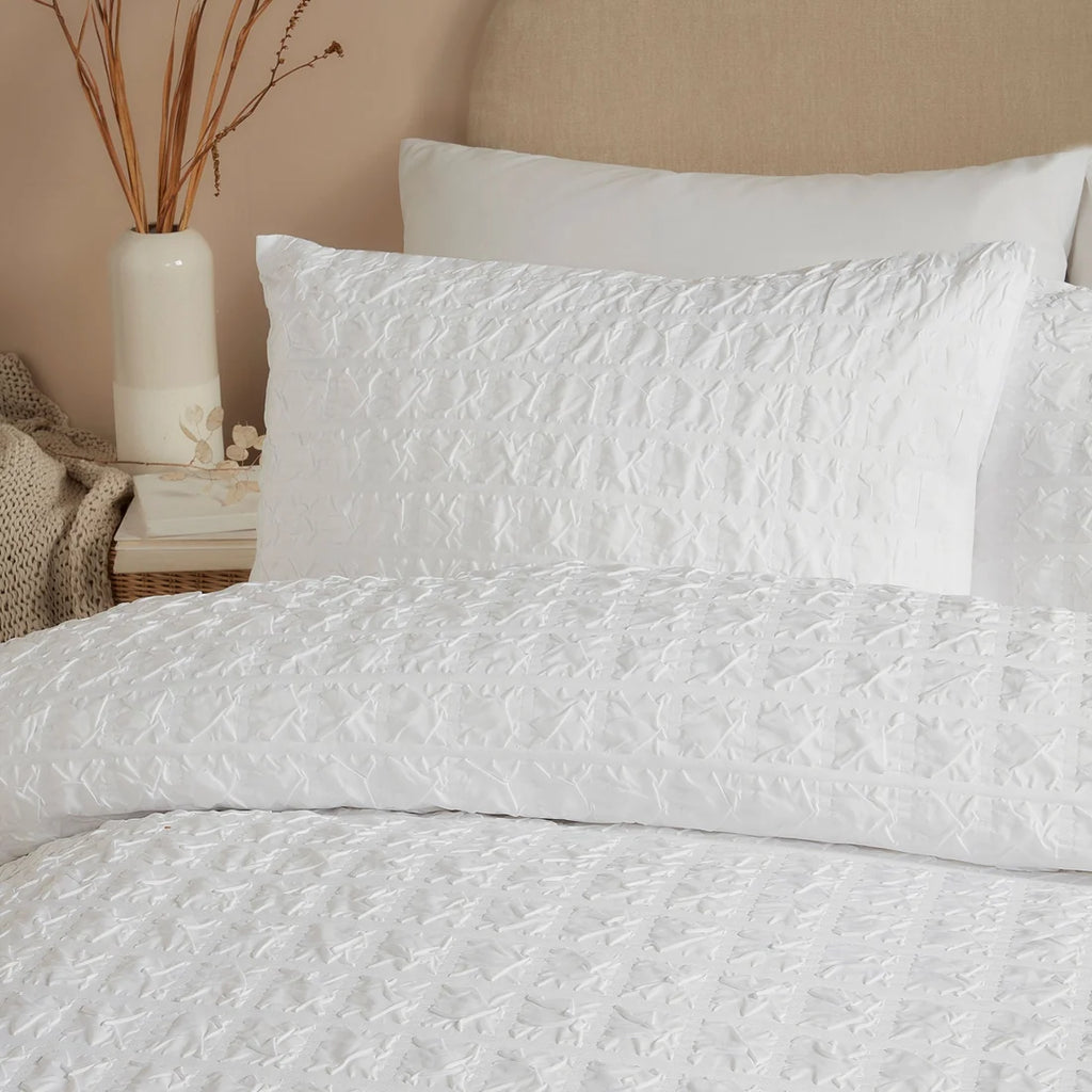 Close-up of the embossed grid texture on the Serene Embossed Grid duvet cover set.
