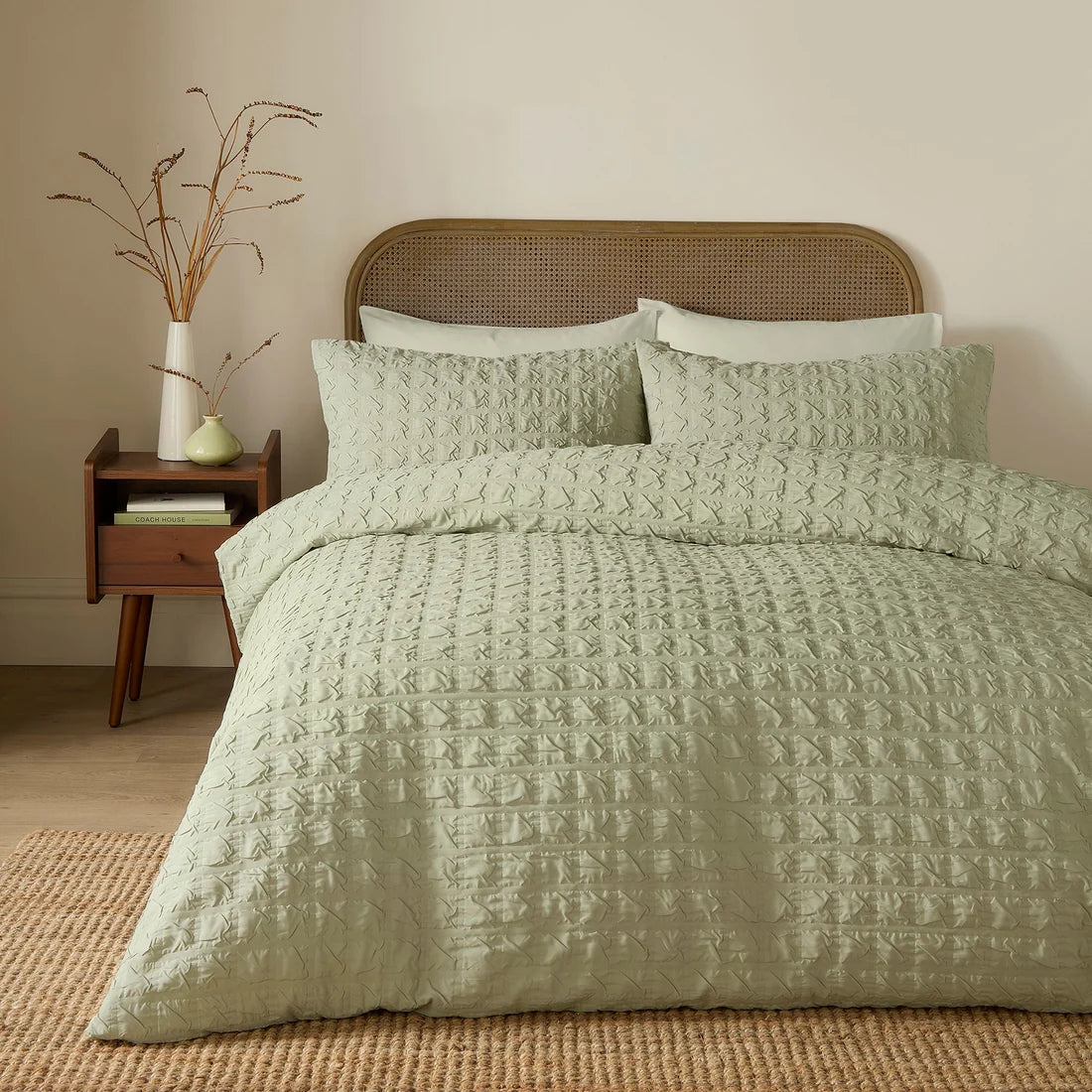 Serene Embossed Grid textured duvet cover set in green with an embossed geometric pattern.