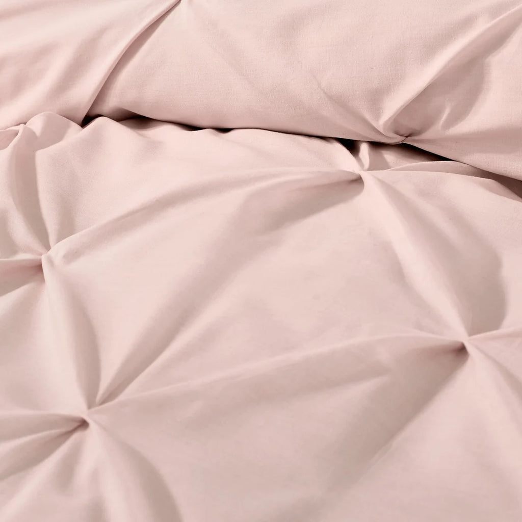 Close-up of the ruched textured design on the Serene Lara blush duvet cover set.