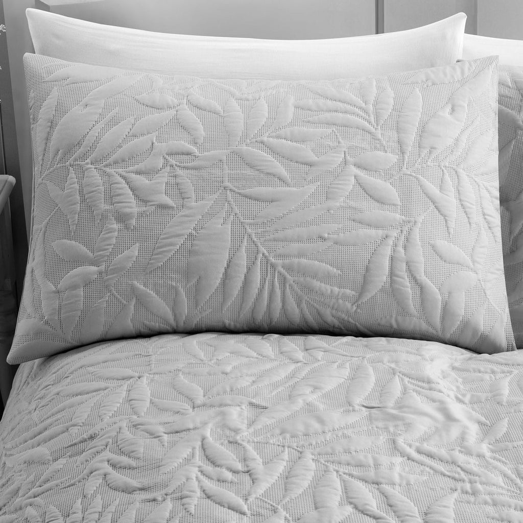 Close-up of the raised floral Pinsonic pattern on the Serene Luana duvet cover set.