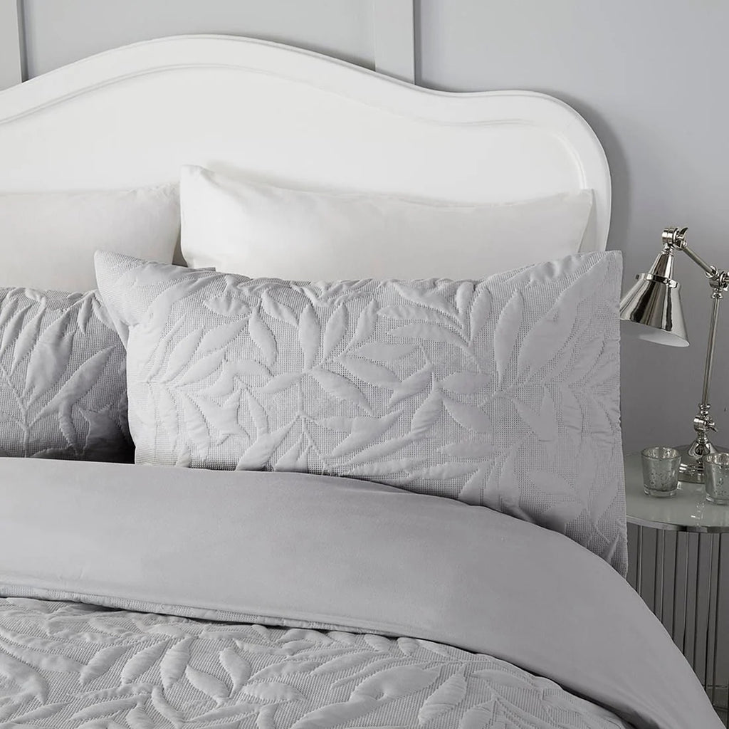 Close-up of the raised floral Pinsonic pattern on the Serene Luana duvet cover set.