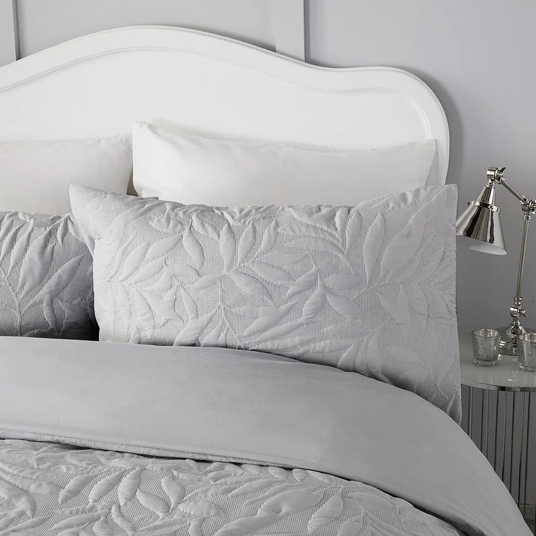 Close-up of the raised floral Pinsonic pattern on the Serene Luana duvet cover set.