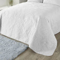 Serene Luana textured floral bedspread in white measuring 200 x 230cm.
