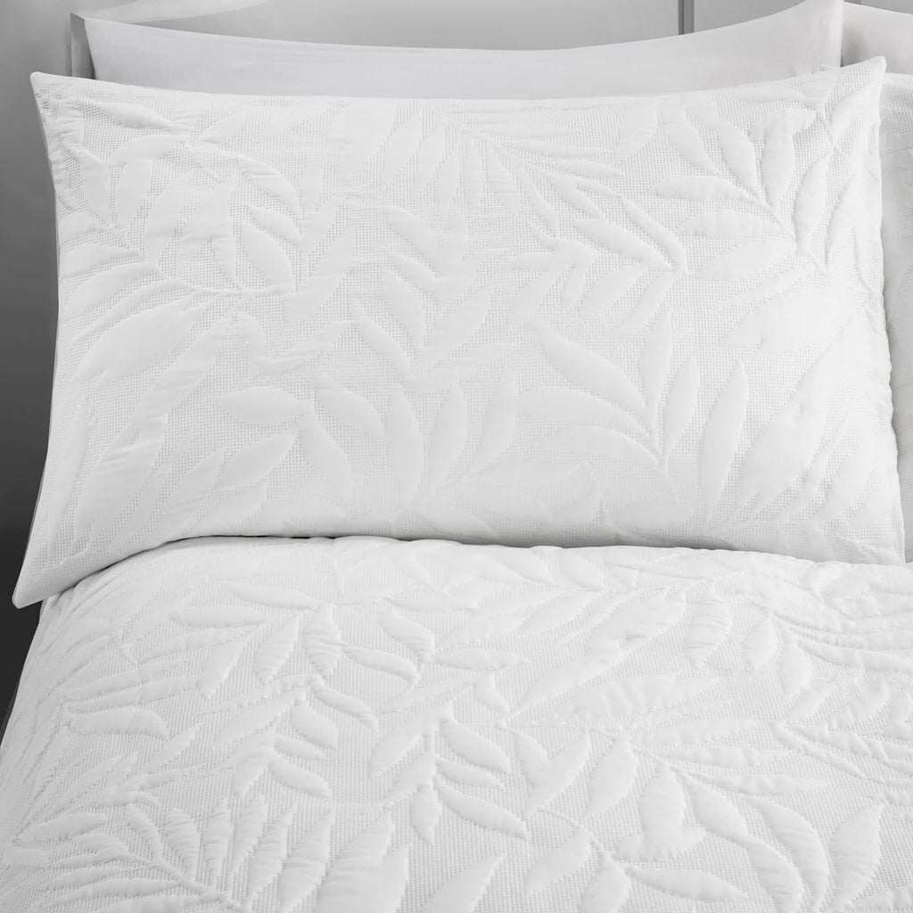Close-up of the raised floral Pinsonic pattern on the Serene Luana white duvet cover set.