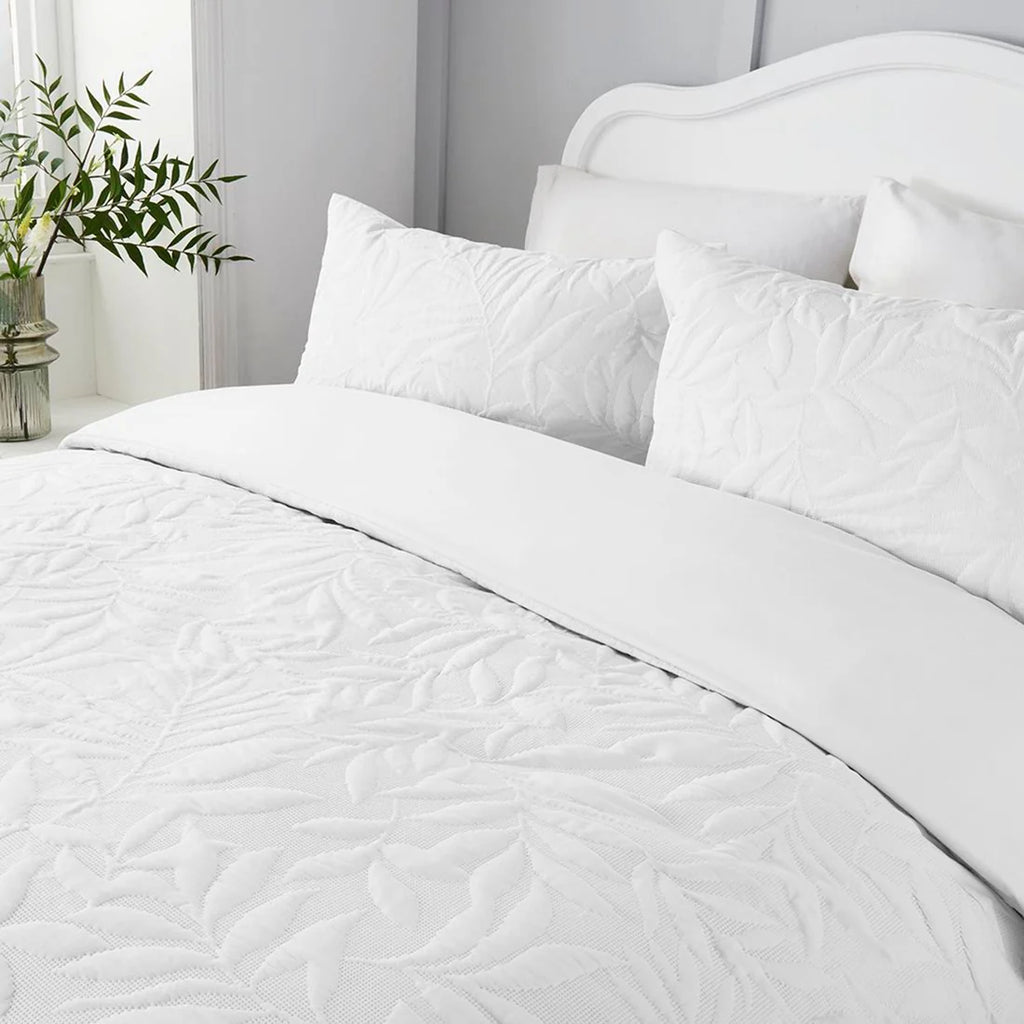 Close-up of the raised floral Pinsonic pattern on the Serene Luana white duvet cover set.