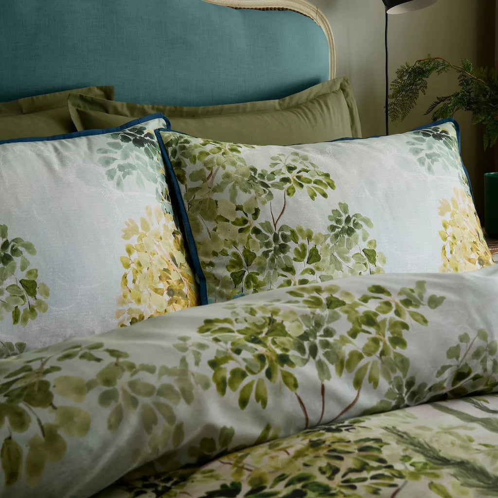 Close-up of the layered foliage design and flat piped edging on the Soiree Hidden Garden duvet cover set.