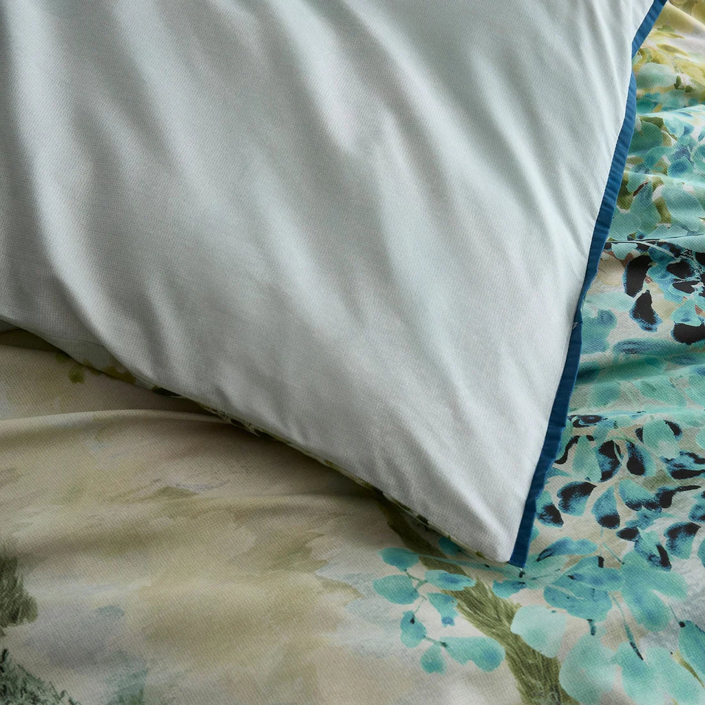 Plain green reverse on the Soiree Hidden Garden duvet cover set.