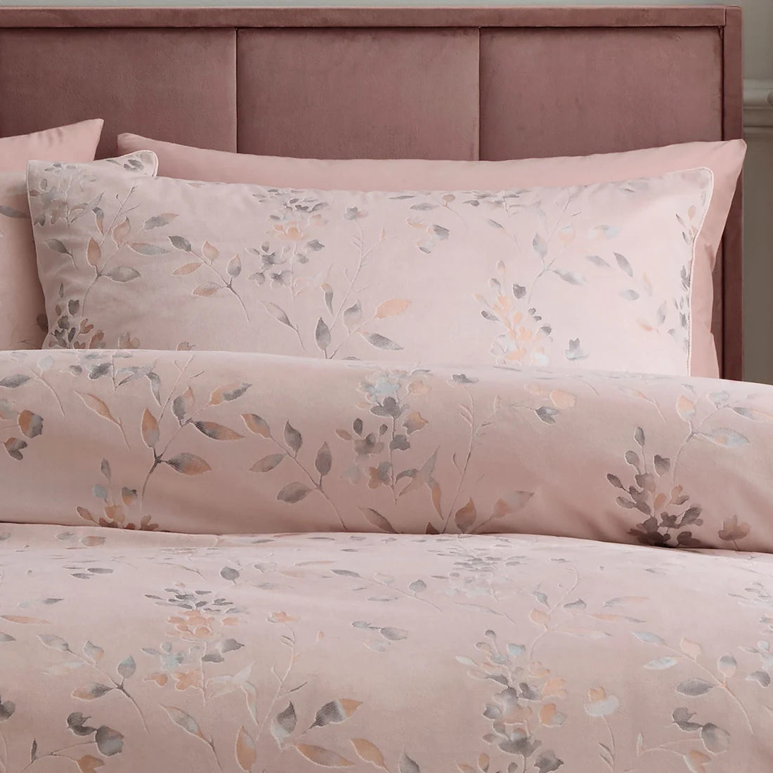 Close-up of the metallic leaf pattern and piped edging on the Soiree Metallic Leaf duvet cover set.