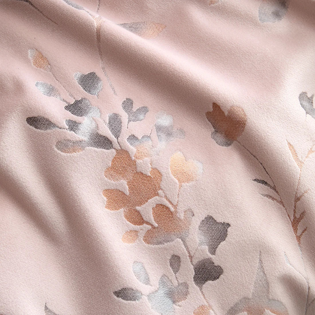 Close-up of the soft velvet-feel polyester fabric on the Soiree Metallic Leaf duvet cover set.