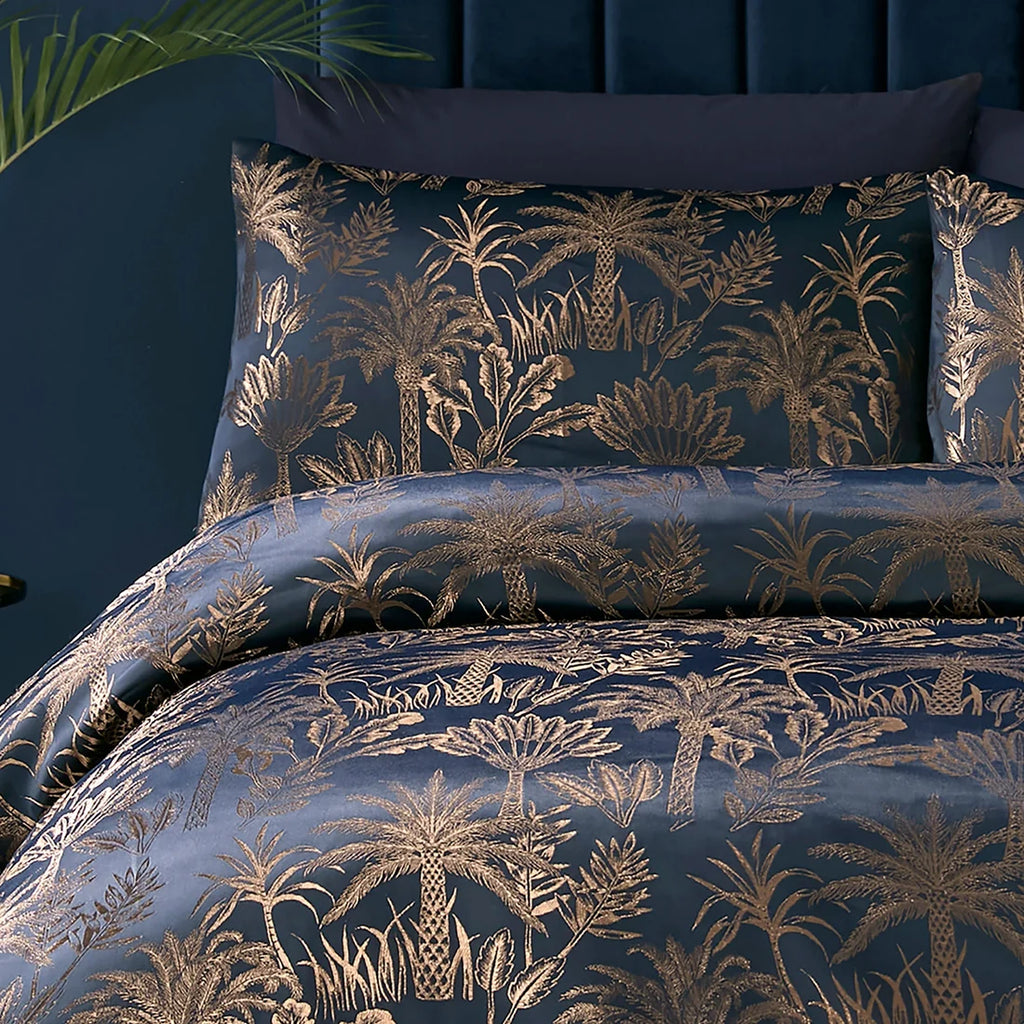 Close-up of the jacquard palm tree pattern with metallic yarn on the Soiree Midnight Palm duvet cover set.