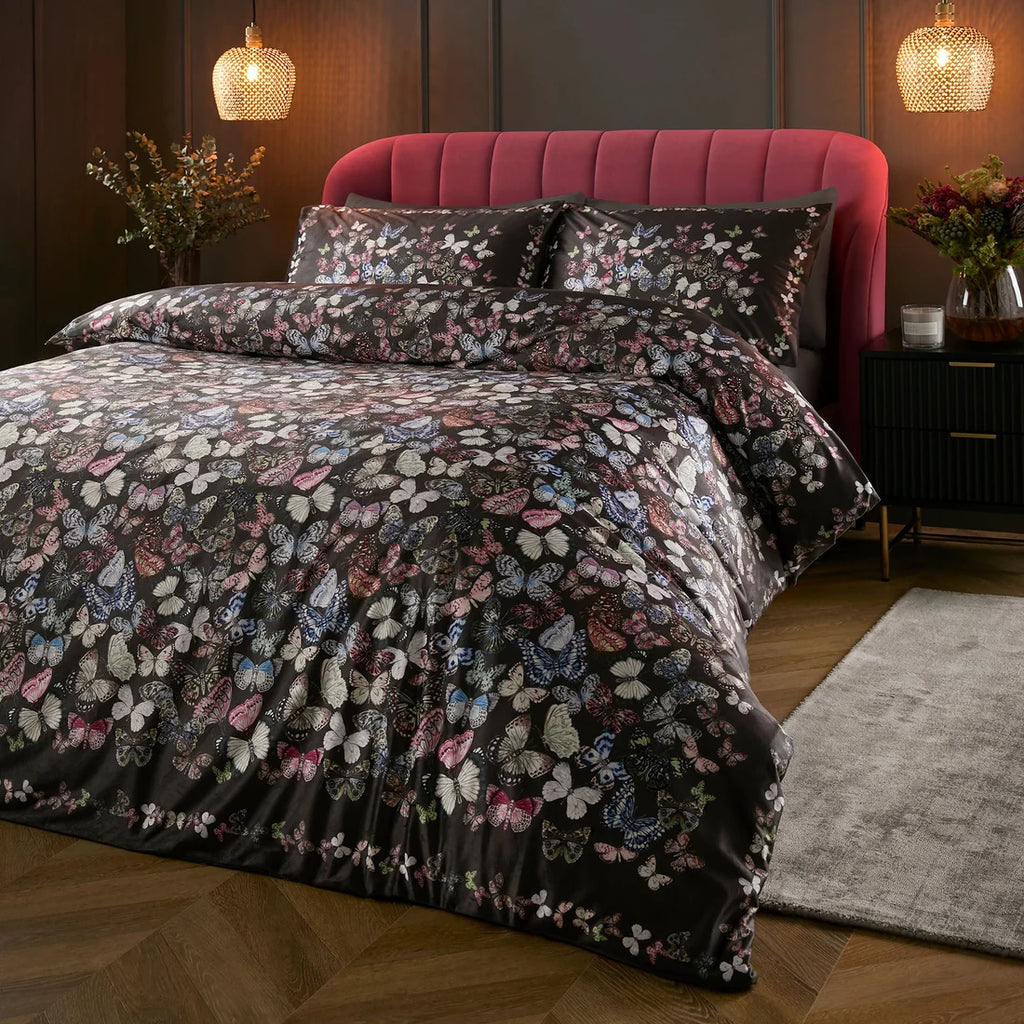 Soiree Papillon velvet panel duvet cover set in charcoal featuring vibrant butterflies.