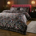 Soiree Papillon velvet panel duvet cover set in charcoal featuring vibrant butterflies.