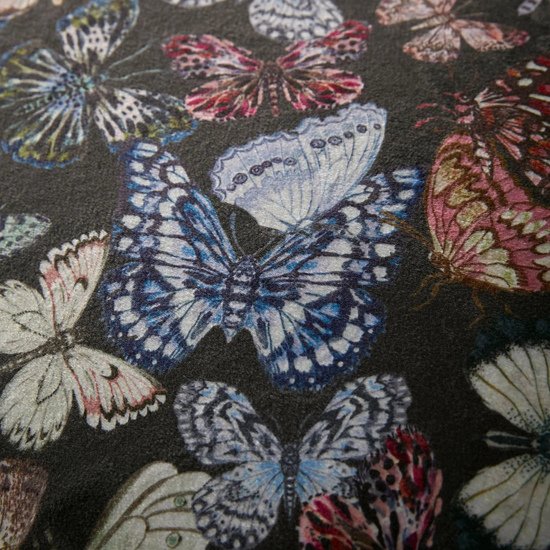 Close-up of the soft velvet-feel polyester fabric on the Soiree Papillon duvet cover set.