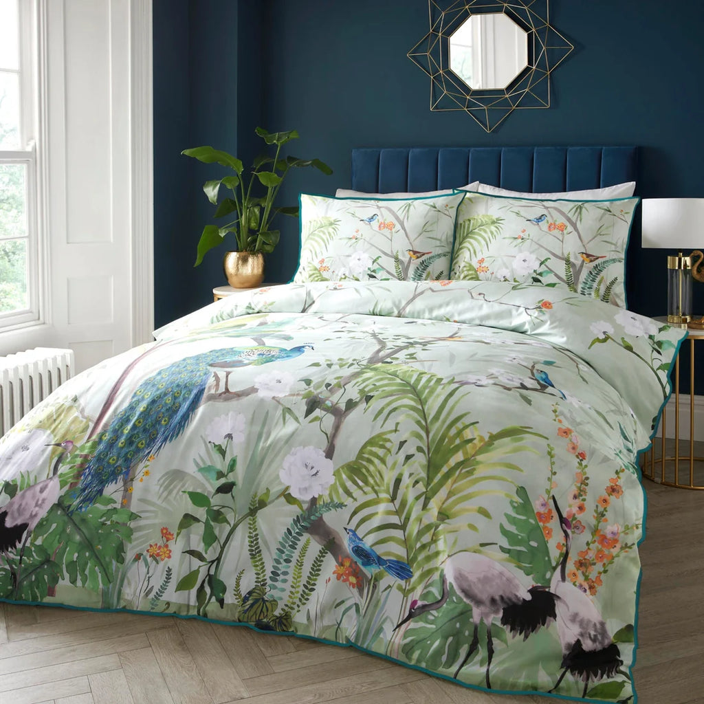 Soiree Peacock Jungle cotton rich duvet cover set in green featuring tropical peacocks and foliage.