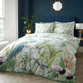 Soiree Peacock Jungle cotton rich duvet cover set in green featuring tropical peacocks and foliage.