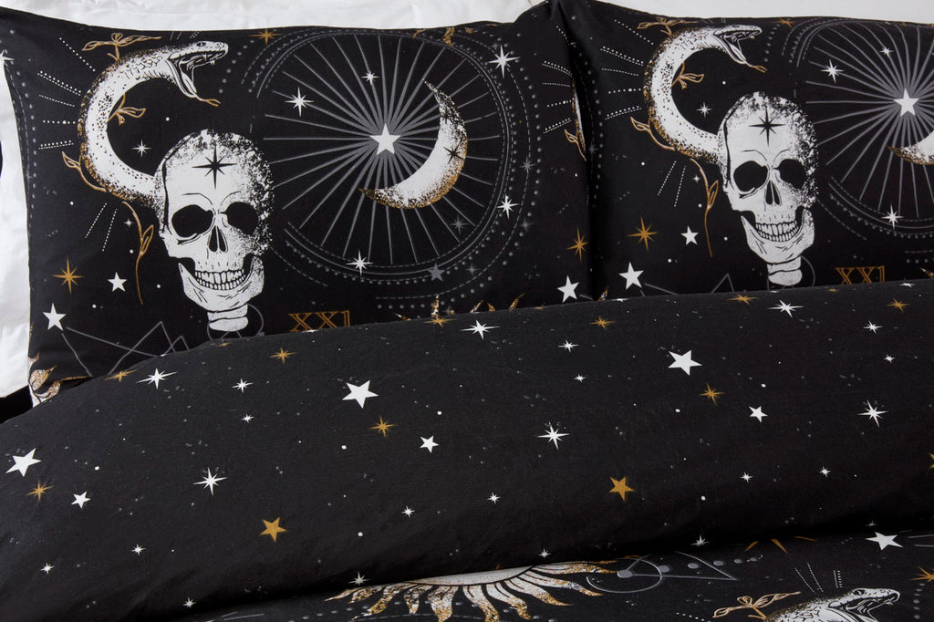 Close-up of the skull, sun and moon design on the Tarot duvet cover set.