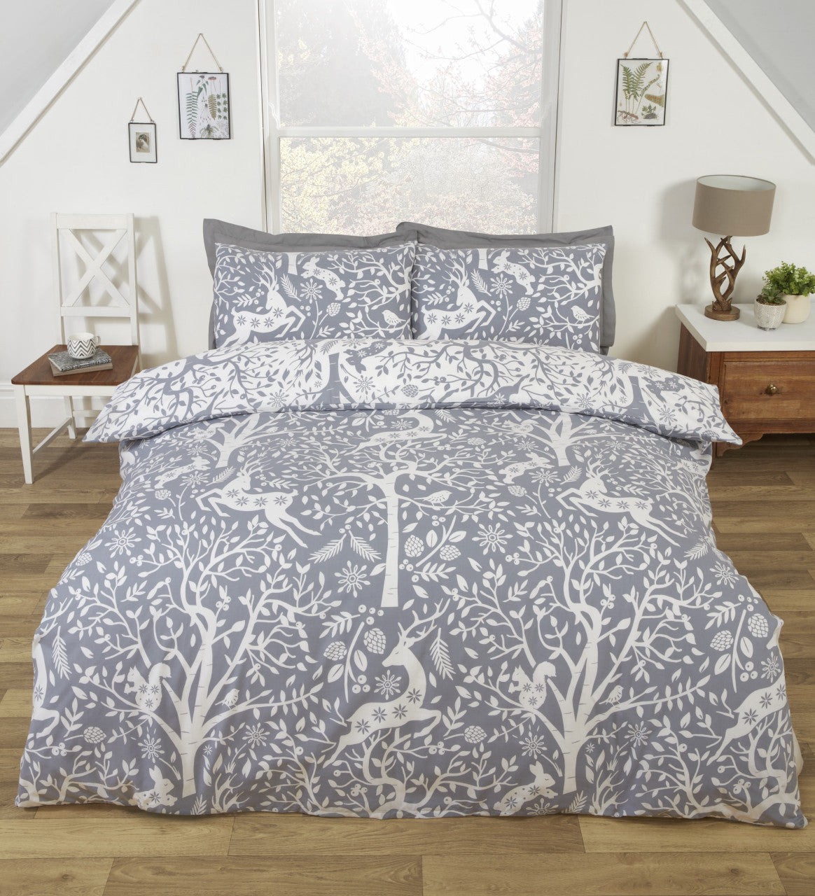 Tatton grey woodland duvet cover set styled in a cosy Scandinavian bedroom.