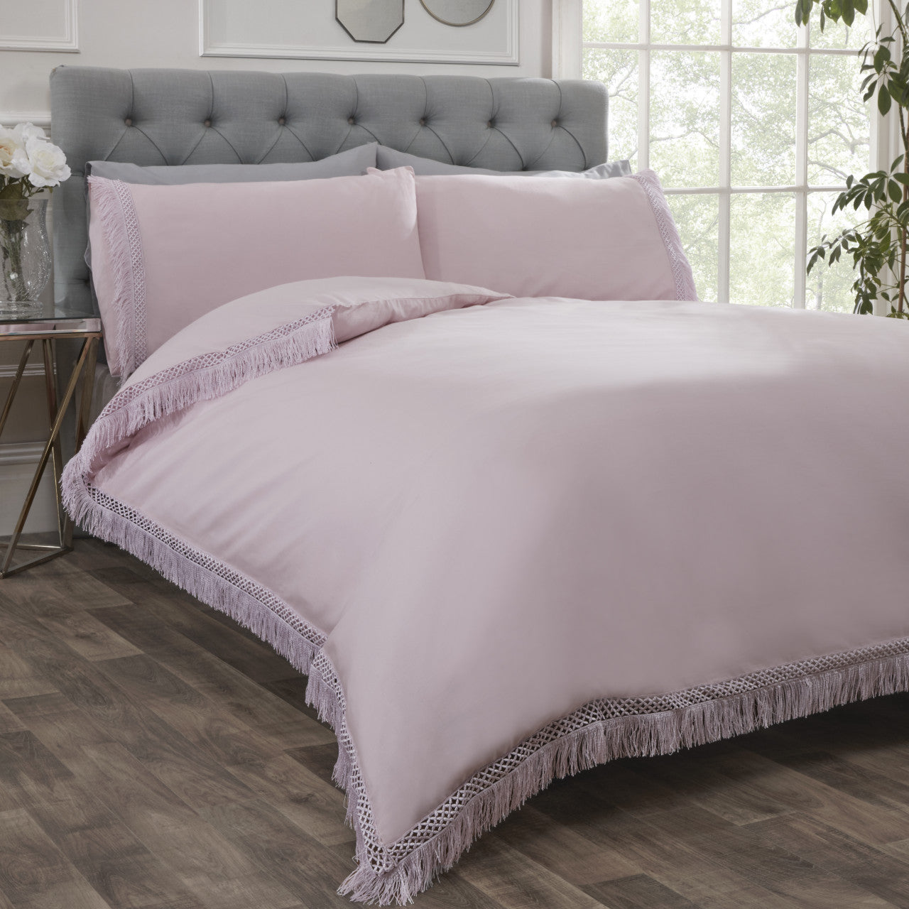 Tia Trellis lace trim polycotton duvet cover set in blush with elegant lace detailing.