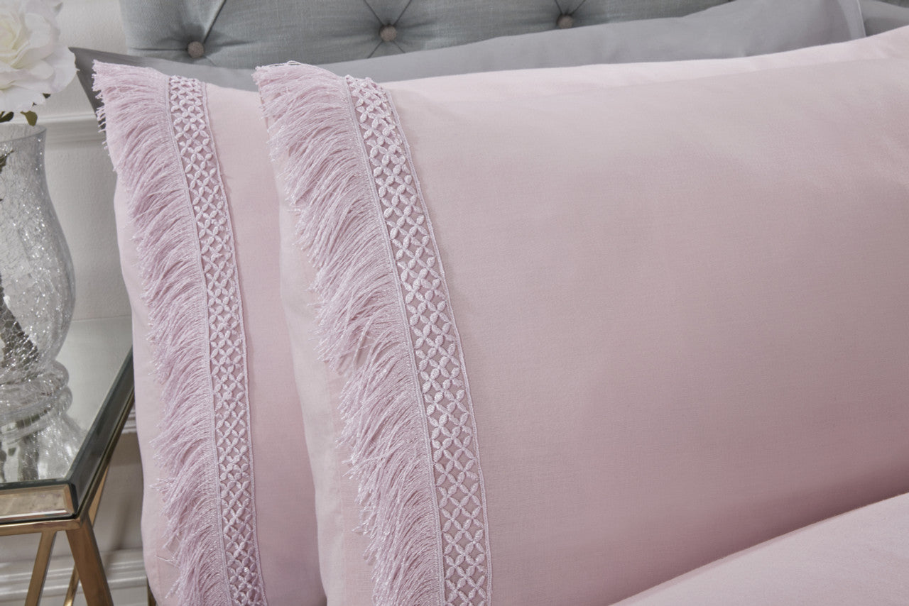Close-up of the soft cotton-rich fabric on the Tia Trellis blush duvet cover set.