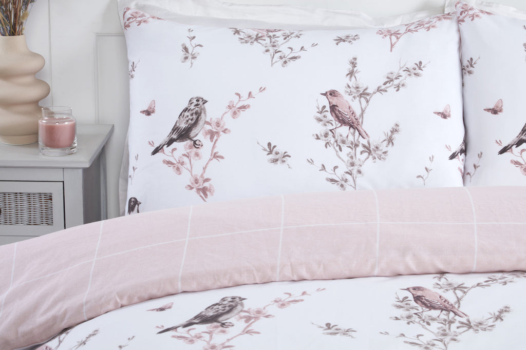 Close-up of the bird and floral toile pattern on the Vintage Toile duvet cover set.